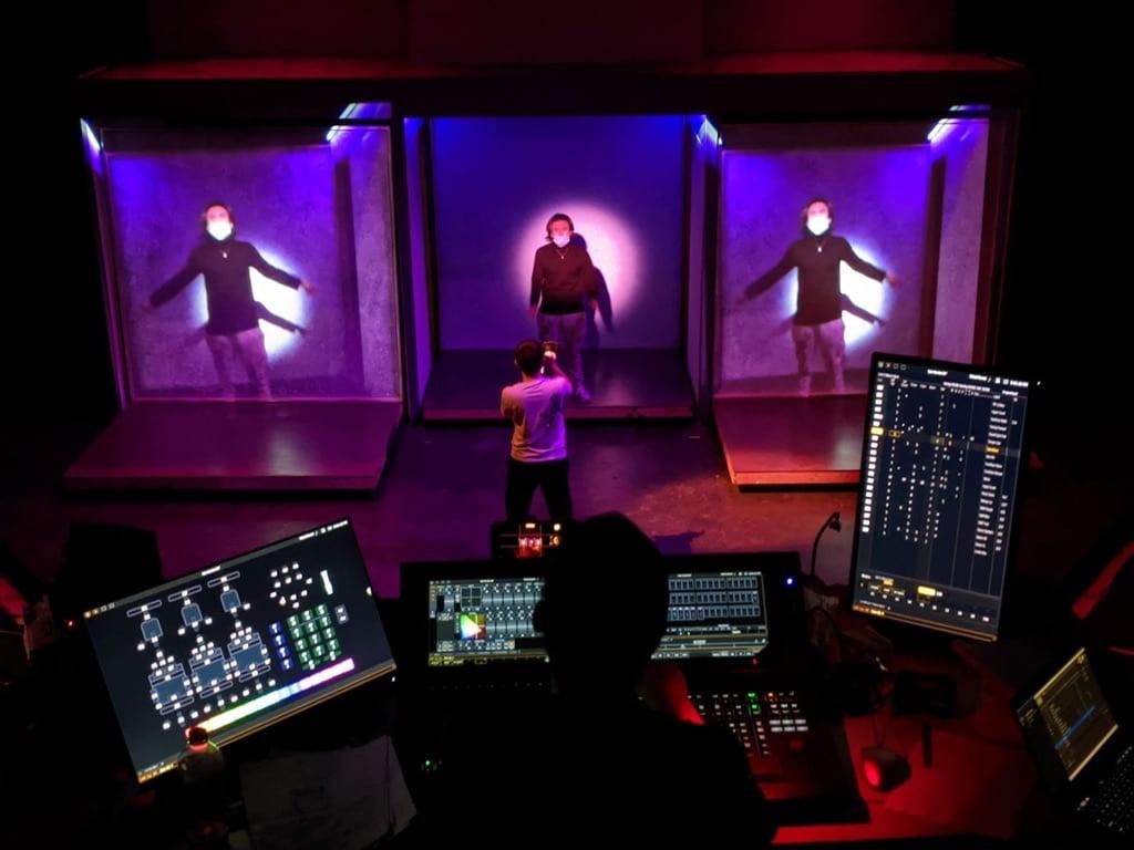 A skilled student lighting designer at work in a technical rehearsal for Open Up! — a devised student variety showcase.